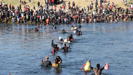 A photo of Haitian illegal aliens crossing the Rio Grande into Texas