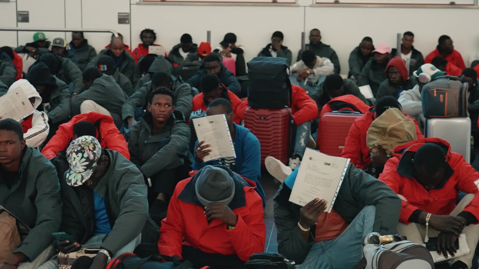 Migrants waiting at Gran Canaria airport to be flown to mainland Spain.