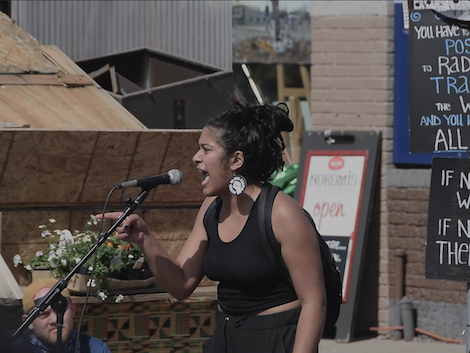 A photo of a woman screaming at George Floyd Square
